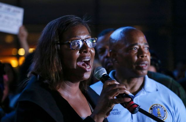 Public Advocate Letitia James speaks during an interfaith candlelight vigil in solidarity with Emanuel AME Church in Charleston, South Carolina outside Barclays Center on June 21, 2015 in the Brooklyn borough of New York City.