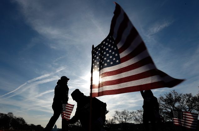 U.S. military veterans set up 1,892 American flags on the National Mall March 27, 2014 in Washington, DC. 
