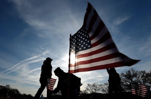 U.S. military veterans set up 1,892 American flags on the National Mall March 27, 2014 in Washington, DC.