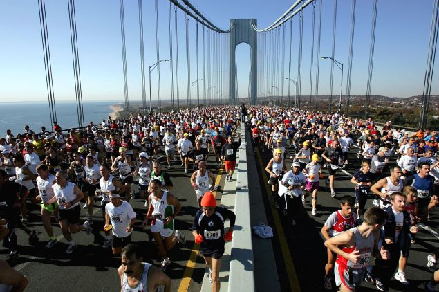 Runners stream over the Verrazano Narrows Bridge at the start of the New York City Marathon.