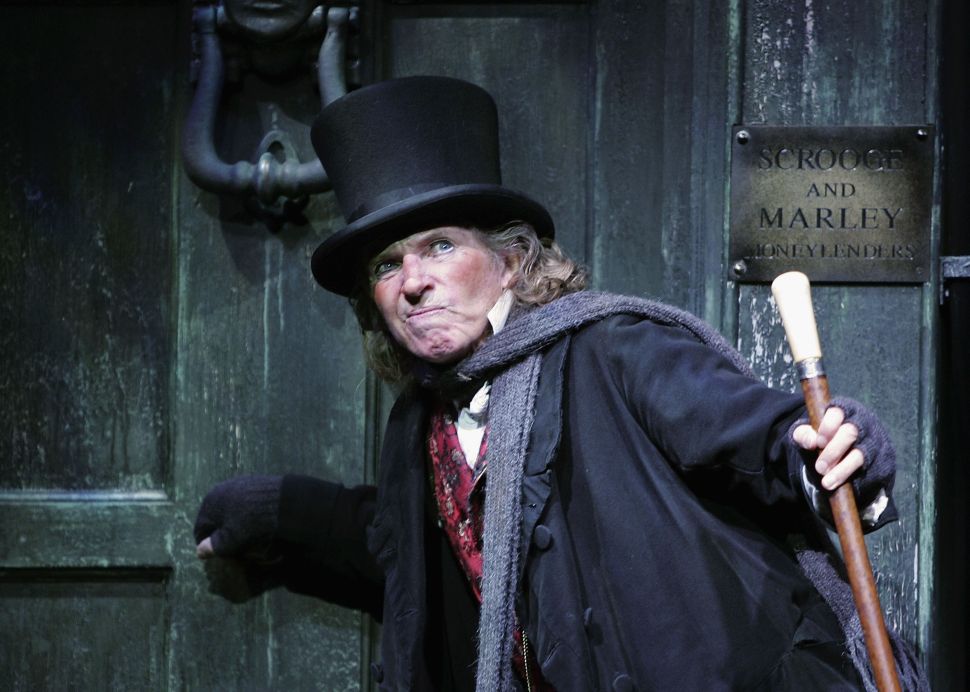Actor Tommy Steele poses at a photocall to promote his role as Ebenezer Scrooge in the new stage version of "Scrooge" at the London Palladium on October 27, 2005 in London, England.