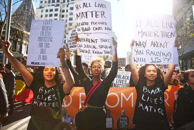 People dressed in black clothes rally to support the Black Lives Matter movement on July 17, 2016 in Melbourne, Australia. The rallies were organised in support of the Black Lives Matter following a spate of police shootings of African American people in the United States last week. The rallies are also aimed at highlighting Indigenous Australian deaths in custody. (Photo by Scott Barbour/Getty Images)