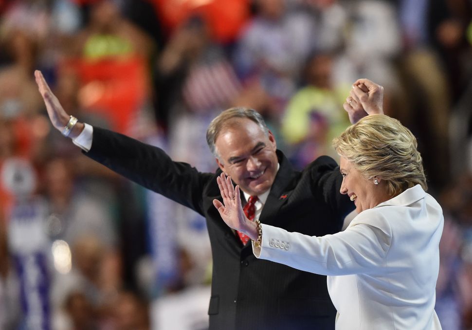 Democratic presidential nominee Hillary Clinton and running mate Tim Kaine celebrate on stage on the fourth and final day of the Democratic National Convention on July 28, 2016 in Philadelphia, Pennsylvania. 