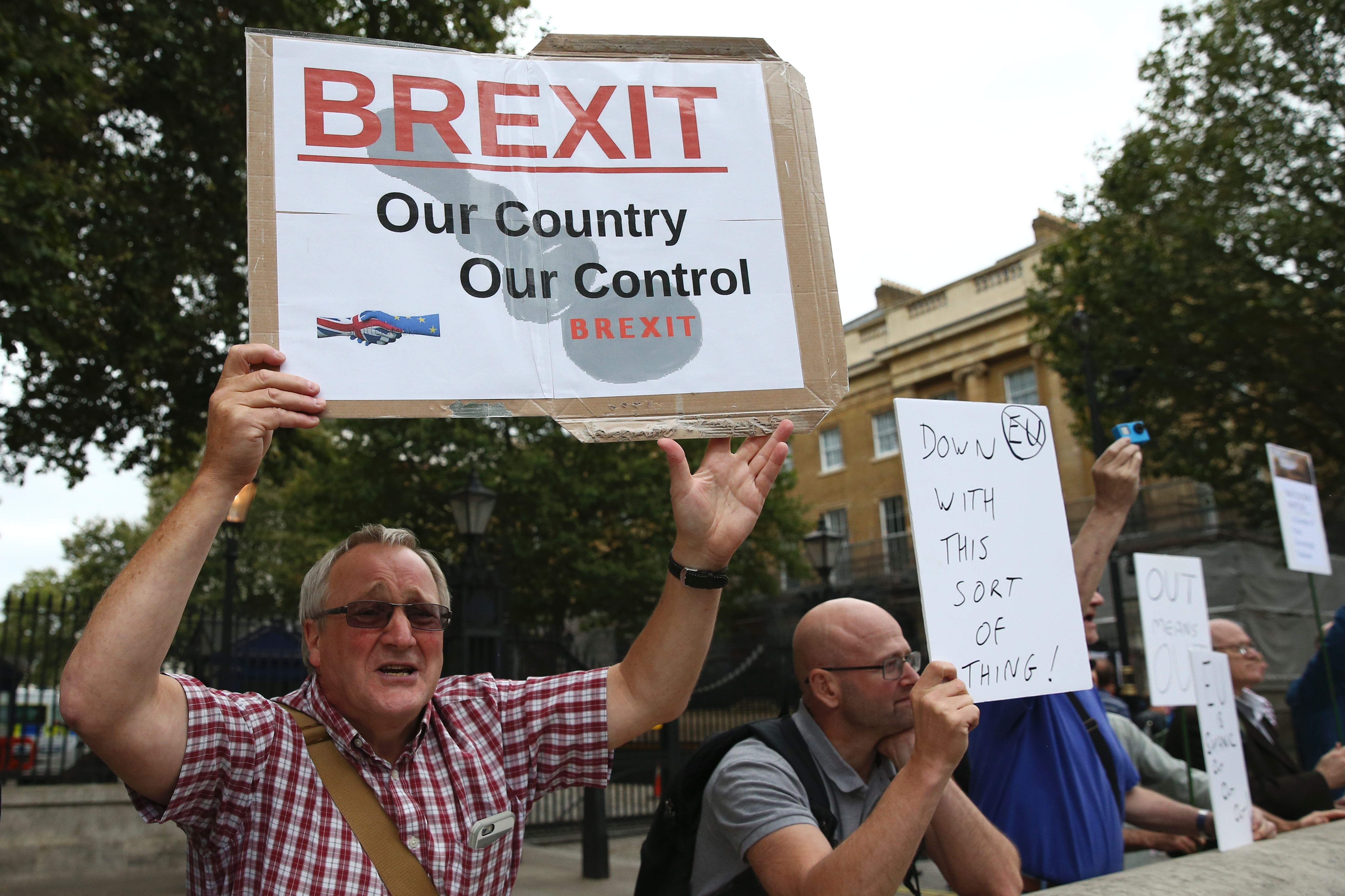 A man carrying an anti-EU pro-Brexit placard joins a counter protest against pro-Europe marchers on a March for Europe demonstration against the Brexit vote in Parliament Square in central London on September 3, 2016.