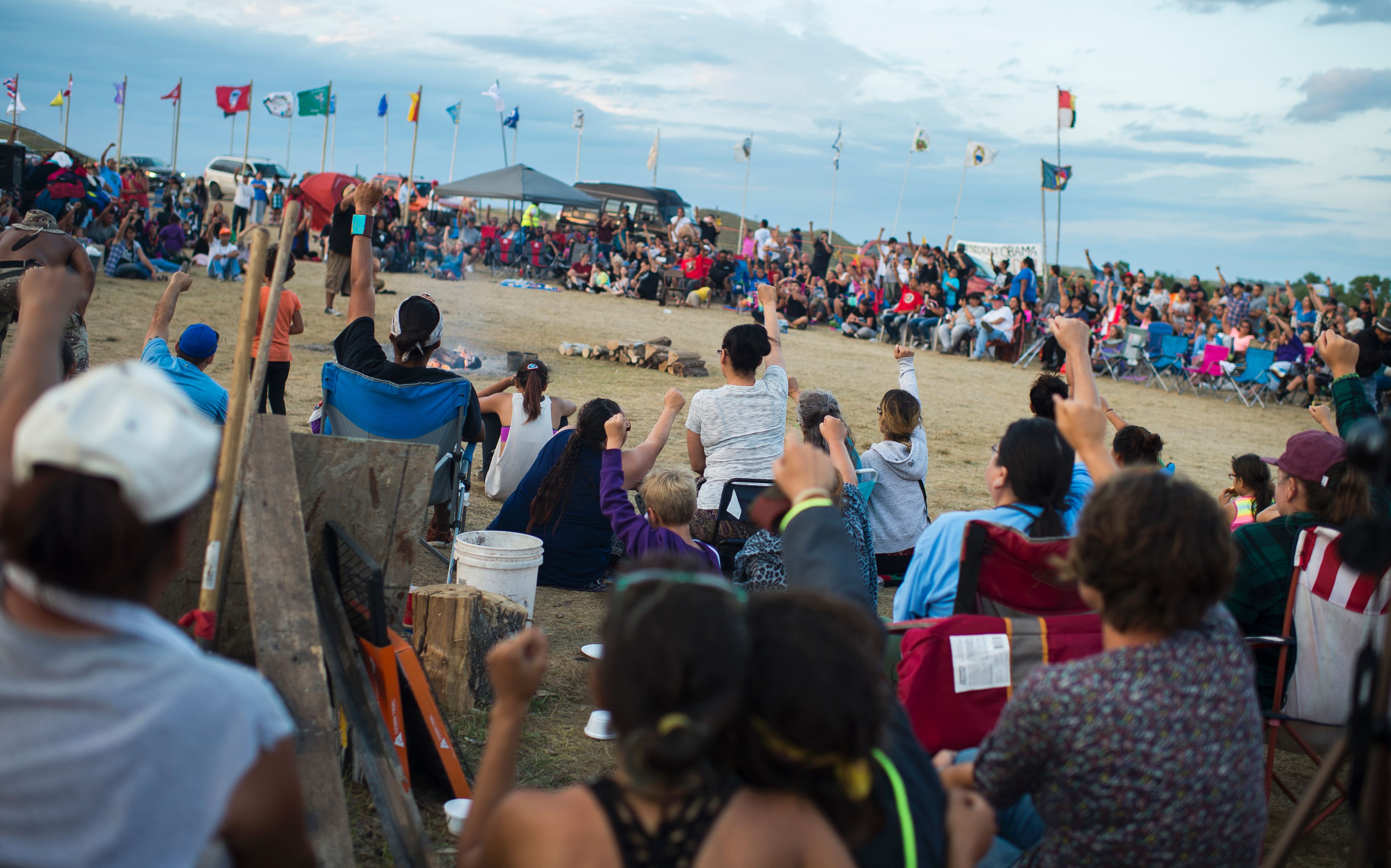 Members of the Standing Rock Sioux tribe and their supporters gather in a circle in the center of camp to hear speakers and singers, at a protest encampment near Cannon Ball, North Dakota where members of the tribe and their supporters have gathered to voice their opposition to the Dakota Access Pipeline (DAPL).