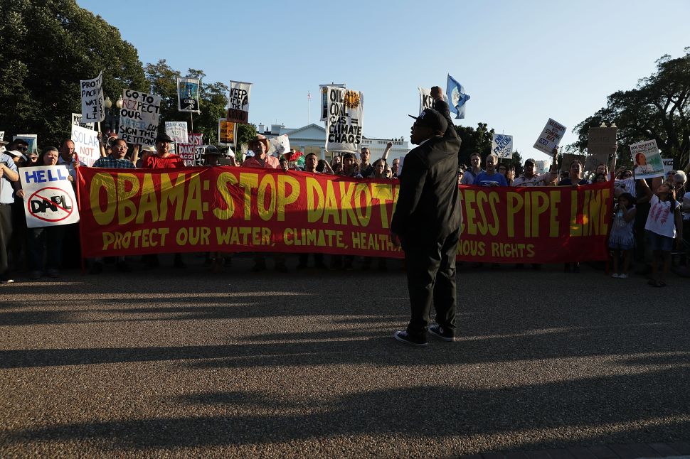 Activists gather in front of the White House during a rally against the Dakota Access Pipeline September 13, 2016 in Washington, DC.