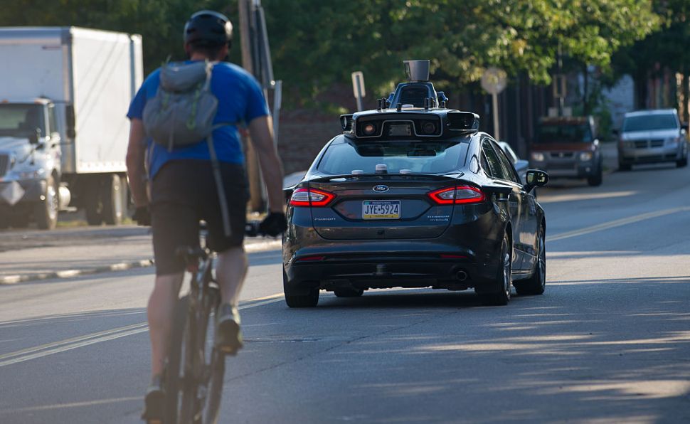 PITTSBURGH, PA - SEPTEMBER 22: An Uber driverless Ford Fusion drives down Smallman Street on September, 22, 2016 in Pittsburgh, Pennsylvania. Uber has built its Uber Technical Center in Pittsburgh and is developing an autonomous vehicle that it hopes will be able to transport its millions of clients without the need for a driver. (Photo by Jeff Swensen/Getty Images)