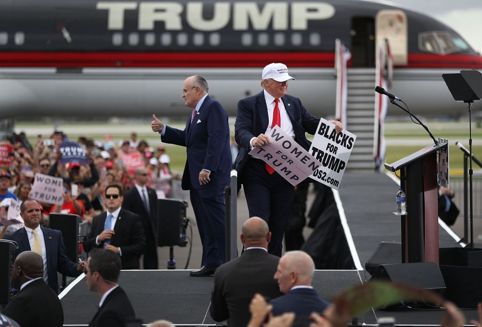 Donald Trump and Rudy Giuliani campaign together during a rally on October 12, 2016 in Lakeland, Florida.