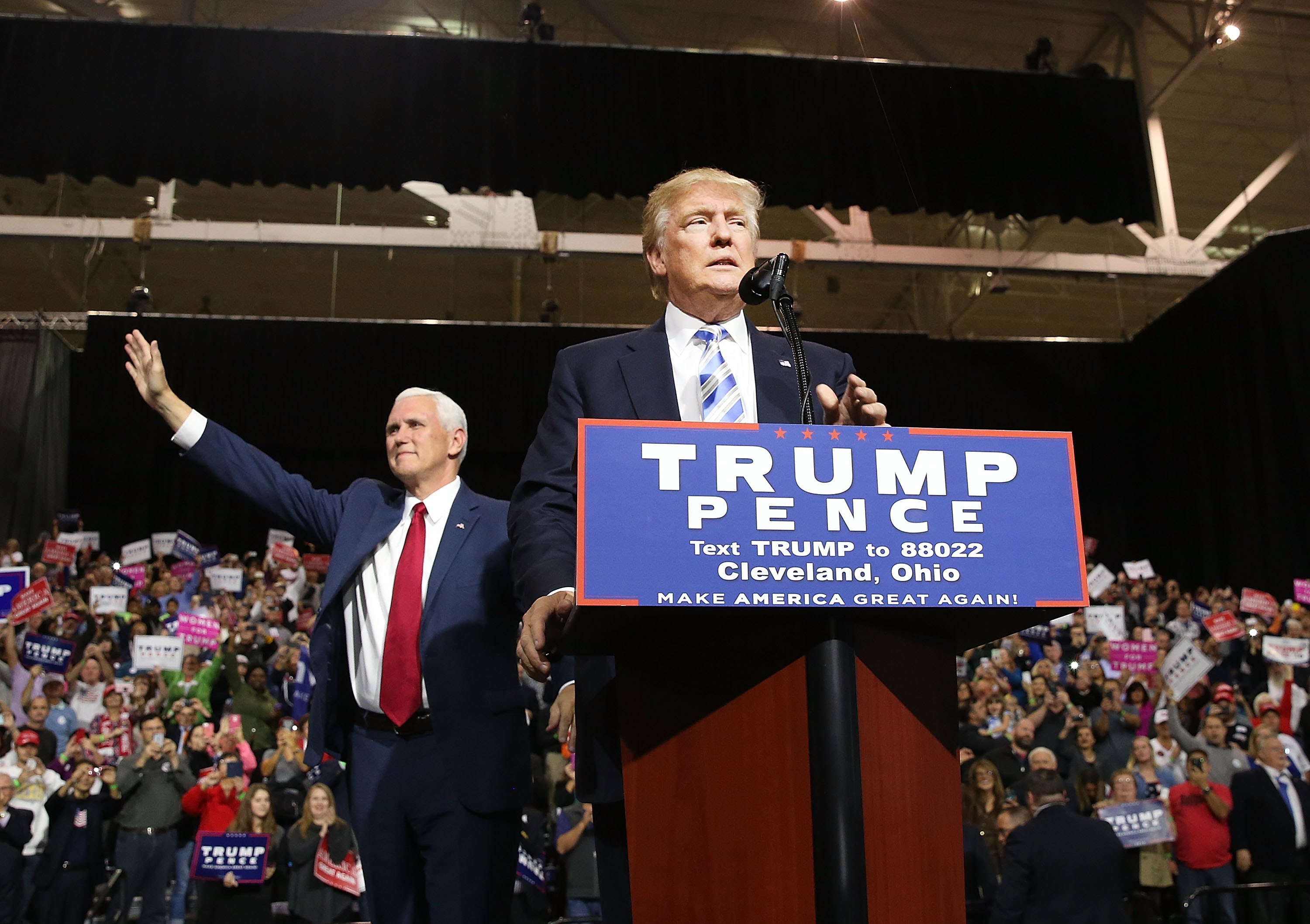 Vice Presidential candidate Mike Pence stands with Donald Trump during a rally on October 22, 2016 in Cleveland, Ohio.