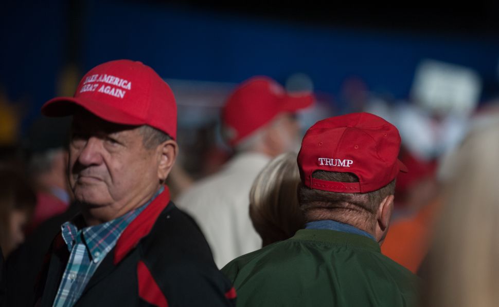 GENEVA, OH - OCTOBER 27: Supporters listen to Republican presidential nominee Donald Trump speak at a campaign rally on October 27, 2016 at the Spire Institute in Geneva, Ohio. Trump spent the day campaigning in Ohio. With less than two weeks to go until election day, Donald Trump continues to campaign in tight battleground states.