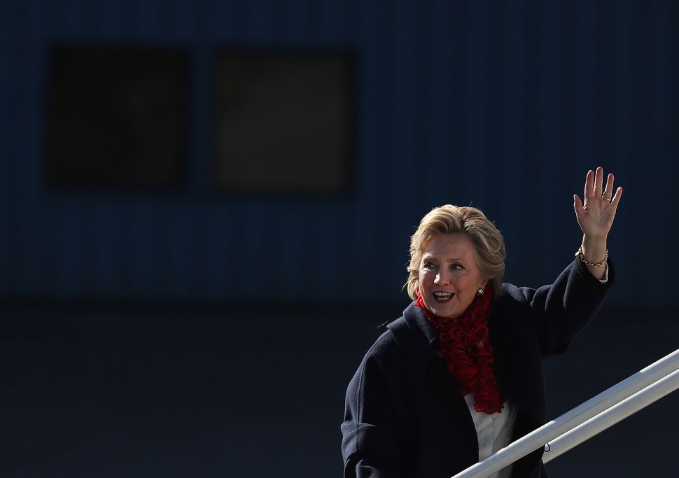Democratic presidential nominee former Secretary of State Hillary Clinton waves as she boards her campaign plane headed for Florida at Westchester County Airport on November 1, 2016 in White Plains, New York. With one week to go until election day, polls remain tight in many battleground states.