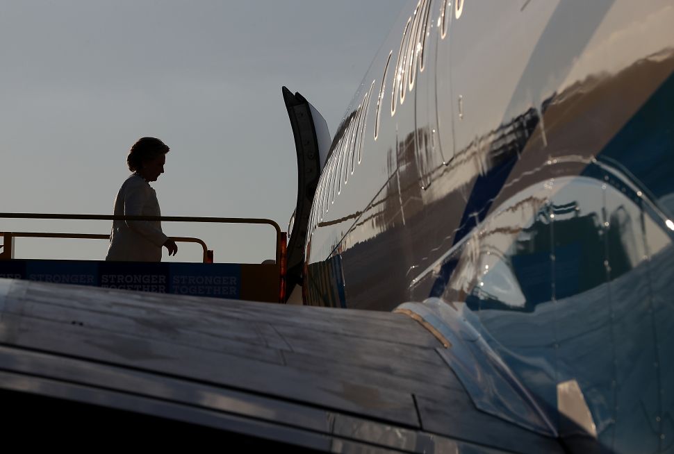 Democratic presidential nominee former Secretary of State Hillary Clinton boards her campaign plane at Lakeland Airport on November 1, 2016 in Lakeland, Florida. With one week to go until election day, Hillary Clinton is campaigning in Florida.