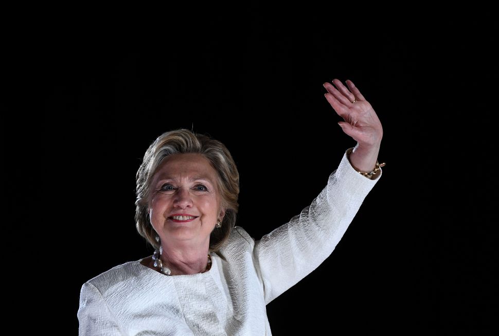 US Democratic presidential nominee Hillary Clinton waves to supporters during a campaign rally in Sanford, Florida, on November 1, 2016. With one week to go until election day, Hillary Clinton and Donald Trump were barnstorming battleground states, as the Democratic nominee tried to pivot away from attacks on her protection of US secrets. / AFP / JEWEL SAMAD