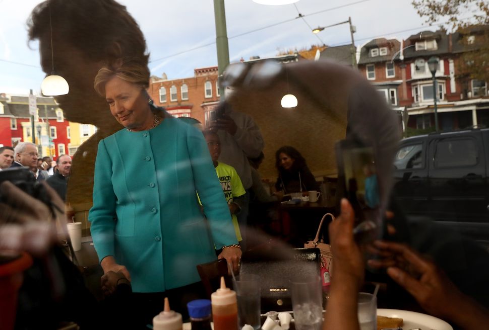Democratic presidential nominee former Secretary of State Hillary Clinton greets patrons at Cedar Park Cafe on November 6, 2016 in Philadelphia, Pennsylvania. With two days to go until election day, Hillary Clinton is campaigning in Florida and Pennsylvania.