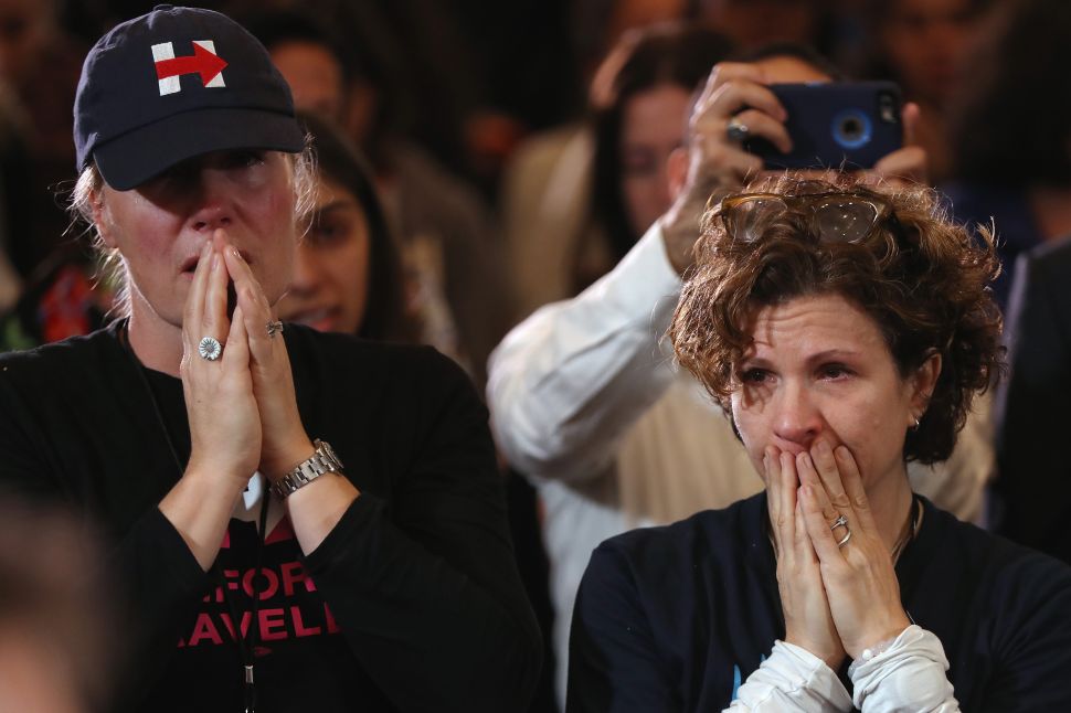 Staffers and supporters react as former Secretary of State Hillary Clinton concedes the presidential election at the New Yorker Hotel on November 9, 2016 in New York City.