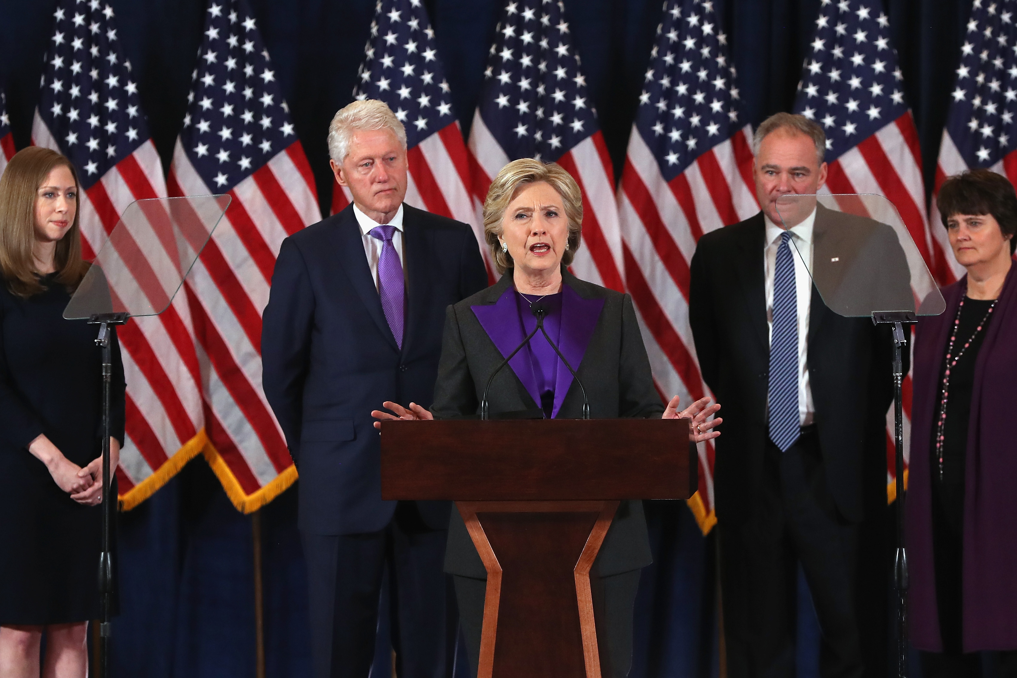 Former Secretary of State Hillary Clinton concedes the presidential election as (L-R) Chelsea Clinton, Bill Clinton, Tim Kaine and Anne Holton listen at the New Yorker Hotel on November 9, 2016 in New York City.