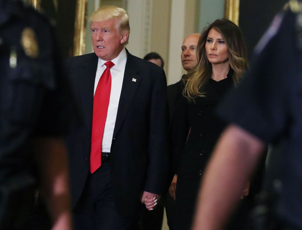 President-elect Donald Trump, his wife Melania Trumpwalk to a meeting with Senate Majority Leader Mitch McConnell at the U.S. Capitol for a meeting November 10, 2016 in Washington, DC. Earlier in the day president-elect Trump met with U.S. President Barack Obama at the White House.
