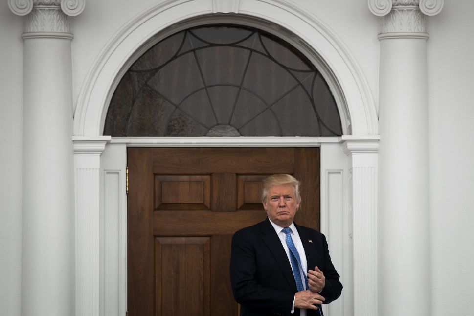 President-elect Donald Trump stands outside the clubhouse following his meeting with Peter Kirsanow, attorney and member of the U.S. Commission on Civil Rights, at Trump International Golf Club, November 20, 2016 in Bedminster Township, New Jersey. 