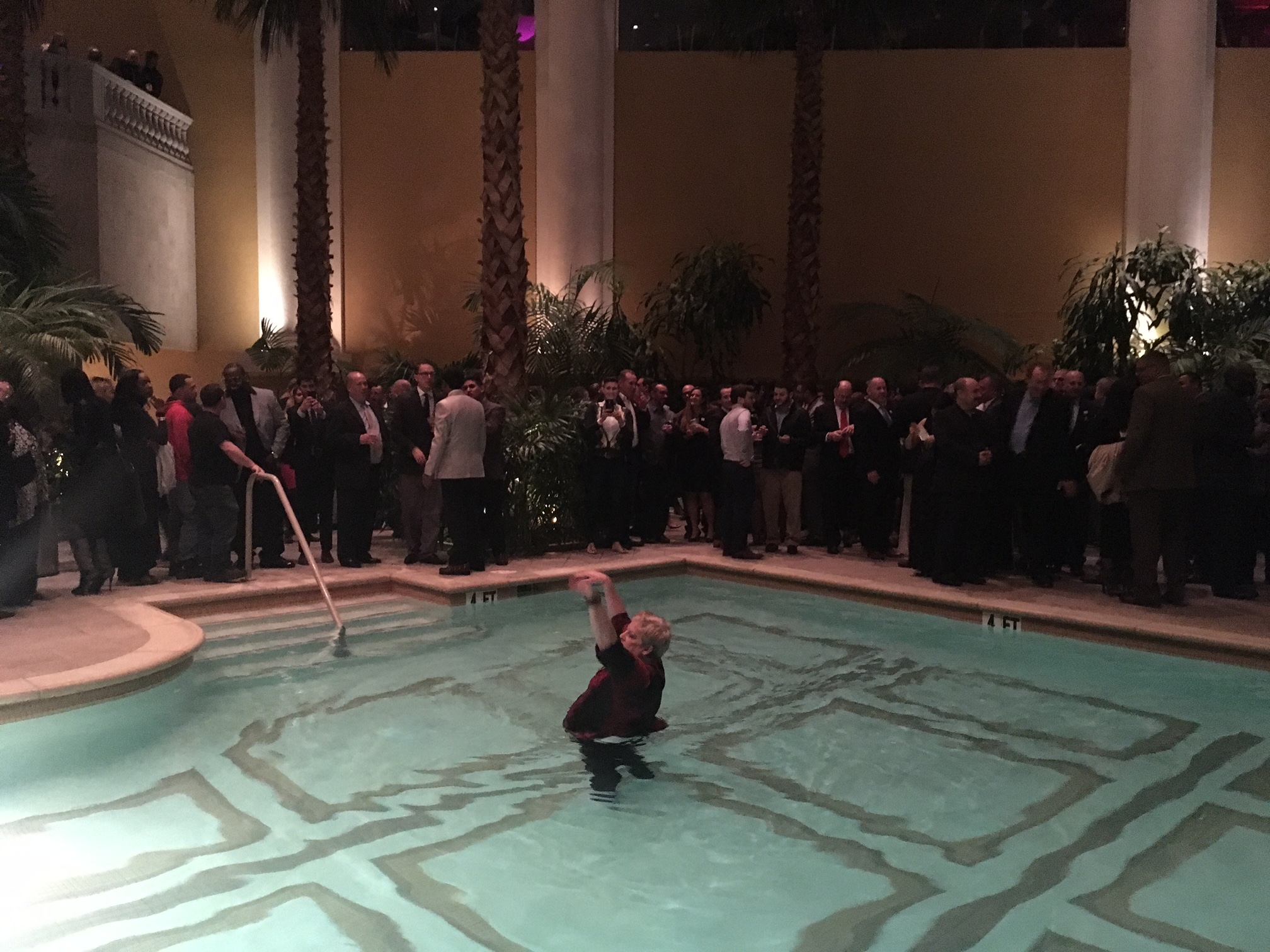 A guest takes a dip in the pool during Murphy's Borgata event.
