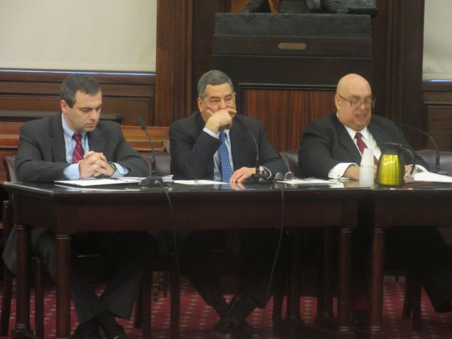 NYPD's Larry Byrnes, center, during a City Council hearing on the nuisance abatement law.