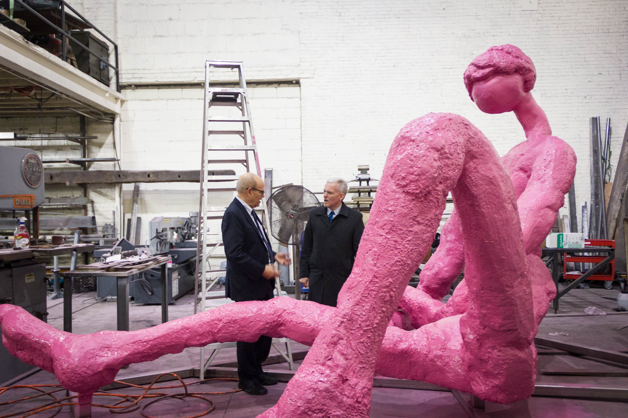 Van Bramer and Finkelpearl giving Sunbathers a final inspection before installation.