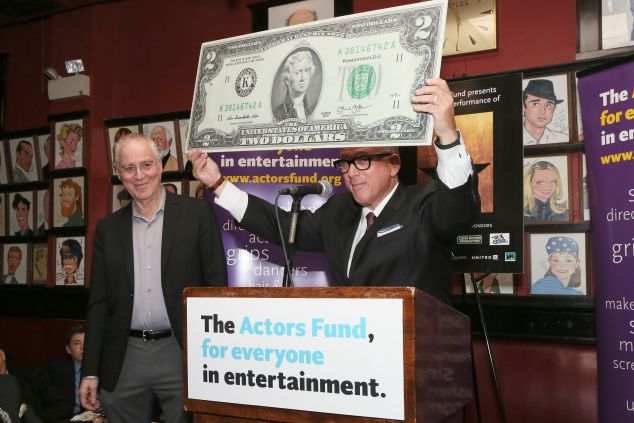 Author Ron Chernow and Actor's Fund treasurer Steve Kalafer joke around with a 2-dollar bill that depicts Hamilton's rival, Thomas Jefferson Jay Brady Photography