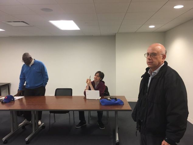 Assemblyman Keith Wright, head of the Manhattan Democratic Party, left, and outgoing Manhattan Board of Elections Commissioner Alan Schulkin, right, at the party's emergency meeting Sunday.