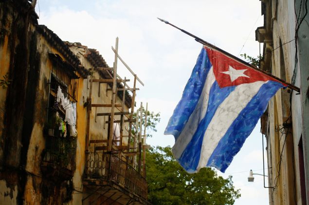 A handpainted Cuban flag outside the open door gallery and studio of an artist in Habana Vieja.