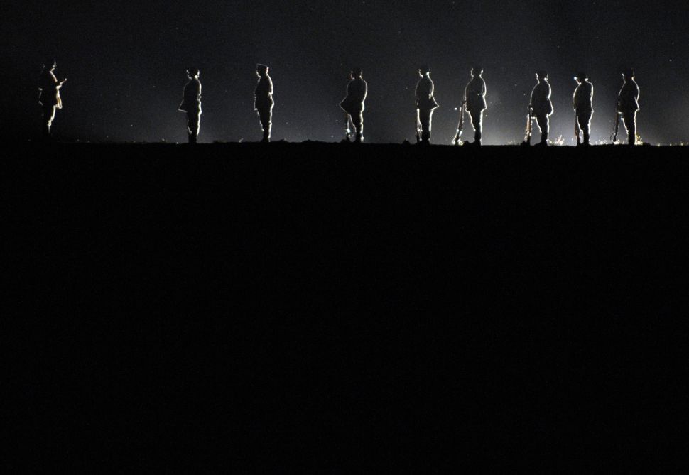 Actors perform during the sound and light show "From flames to the light," on June 27, 2014 in Haudainville, France. The show, presents a scenic reenactment of the Battle of Verdun.