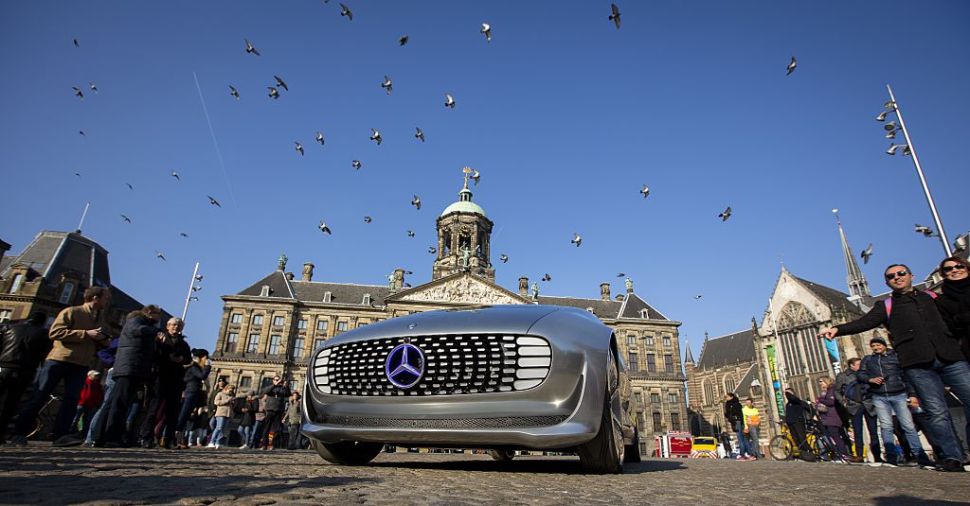 The Mercedes Benz F 015 self-driving stands on March 13, 2016 at the Dam square in Amsterdam. This model is presented for the first time in Europe. / AFP / ANP / Bart Maat / Netherlands OUT (Photo credit should read BART MAAT/AFP/Getty Images)