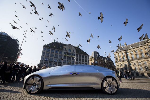 The Mercedes Benz F 015 self-driving stands on March 13, 2016 at the Dam square in Amsterdam. This model is presented for the first time in Europe. / AFP / ANP / Bart Maat / Netherlands OUT (Photo credit should read BART MAAT/AFP/Getty Images)