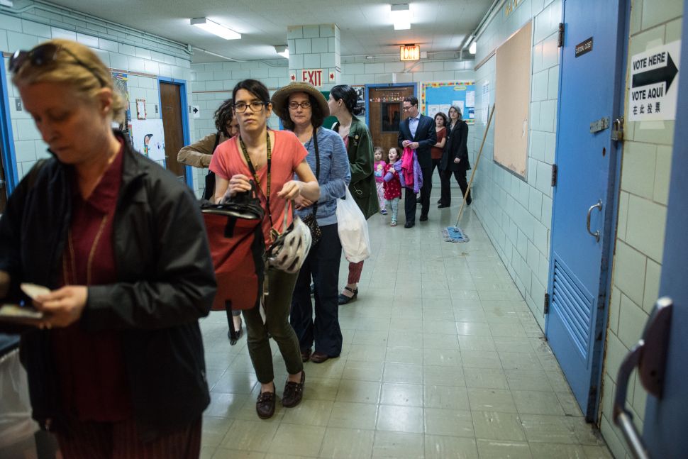 People line up to check into their voting station at Public School 321 on April 19, 2016 in the Brooklyn borough of New York City. 