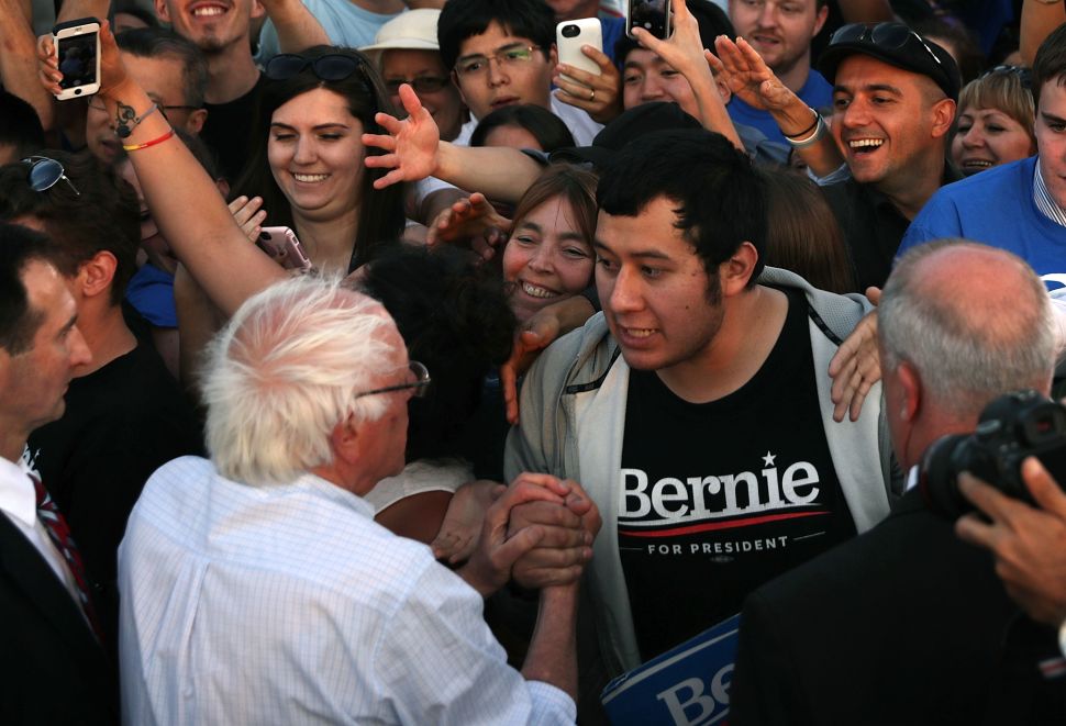 Sen. Bernie Sanders greets supporters during a rally near the Robert F. Kennedy Memorial Stadium June 9, 2016 in Washington, DC.