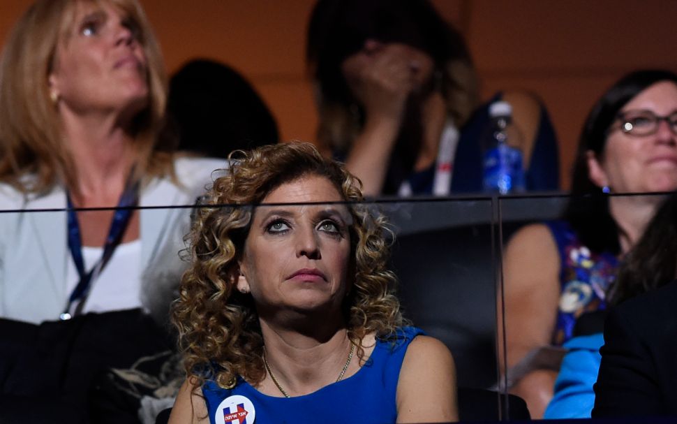 Former chair of the Democratic National Committee Debbie Wasserman Schultz listens to the biographical film presentation of Democratic presidential nominee Hillary Clinton during the fourth and final night of the Democratic National Convention at Wells Fargo Center on July 28, 2016 in Philadelphia, Pennsylvania.