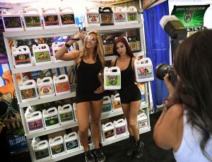 Models promote fertilisers used in the growth of marijuana plants at the Cannabis World Congress in Los Angeles, California on September 9, 2016. The three day event provides education, resources and tools for those involved in the fast growing cannabis industry in the United States. 