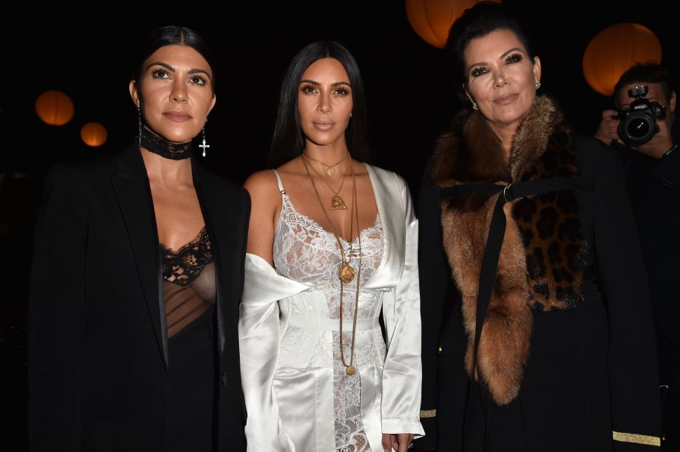 PARIS, FRANCE - OCTOBER 02: (L-R) Kourtney Kardashian, Kim Kardashian and Kris Jenner attend the Givenchy show as part of the Paris Fashion Week Womenswear Spring/Summer 2017 on October 2, 2016 in Paris, France. 