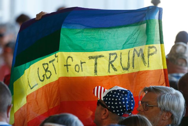 GRAND JUNCTION, CO - OCTOBER 18: Supporters hold up a gay pride flag for Republican presidential candidate Donald Trump on October 18, 2016 in Grand Junction Colorado. Trump is on his way to Las Vegas for the third and final presidential debate against Democratic rival Hillary Clinton. (Photo by George Frey/Getty Images