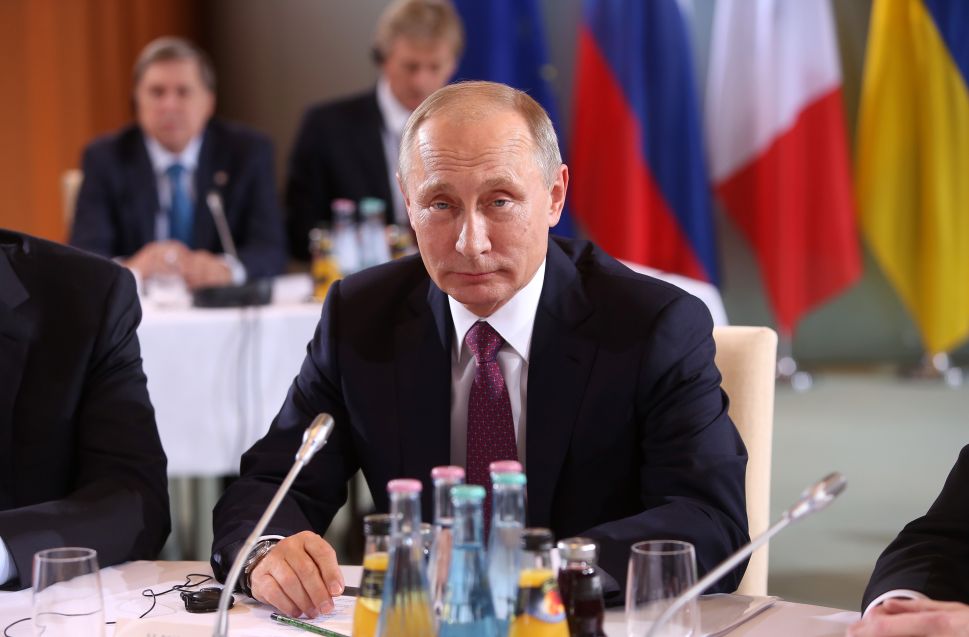 BERLIN, GERMANY - OCTOBER 19: Russian President Vladimir Putin attends a meeting to discuss the Ukrainian peace process at the German federal Chancellery on October 19, 2016 in Berlin, Germany. The leaders of Russia, Ukraine, France and Germany, known as the Normandy Four, met in Berlin to discuss implementation of the peace plan known as the Minsk Protocol, a roadmap for resolving the conflict in Ukraine after Russian forces invaded in 2014 and annexed the peninsula of Crimea. The United States has threatened renewed sanctions on Russia if the country did not either implement the plan in the coming months or arrive at a plan on how to do so.