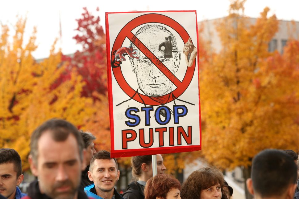 BERLIN, GERMANY - OCTOBER 19: Activists demonstrate at a protest against Russian military operations in Syria during a visit by Russian President Vladimir Putin to the German federal Chancellery on October 19, 2016 in Berlin, Germany. The leaders of Russia, Ukraine, France and Germany, known as the Normandy Four, met in Berlin to discuss implementation of the peace plan known as the Minsk Protocol, a roadmap for resolving the conflict in Ukraine after Russian forces invaded in 2014 and annexed the peninsula of Crimea. The United States has threatened renewed sanctions on Russia if the country did not either implement the plan in the coming months or arrive at a plan on how to do so.