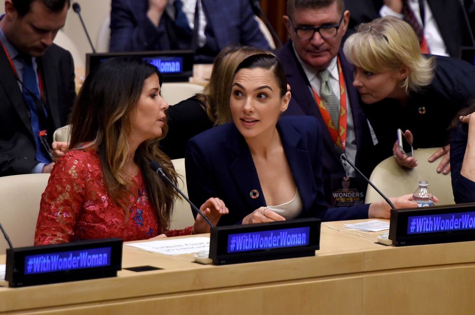 Director Patty Jenkins (L) and actress Gal Gadot attend a ceremony as the UN names the comic character Wonder Woman its Honorary Ambassador for the Empowerment of Women and Girls at the United Nations Economic and Social Council Chamber on October 21, 2016, in New York. Jenkins directed the film "Wonder Woman" due to be released in June 2017 with Gador in the title role. The honorary title comes as Wonder Woman turns 75 years old. / AFP / TIMOTHY A. CLARY