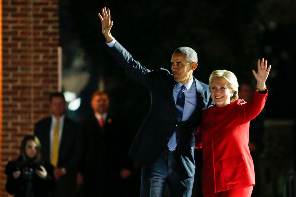 US Democratic presidential nominee Hillary Clinton and President Barack Obama wave to the crowd after a rally on the final night of the 2016 US presidential campaign at Independence Mall in Philadelphia, Pennsylvania, November 07, 2016.