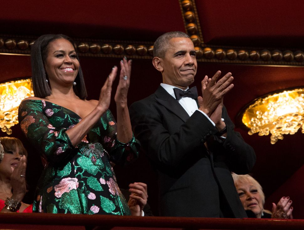 President Barack Obama and first lady Michelle Obama attend the Kennedy Center Honors show December 4, 2016 at the Kennedy Center in Washington, DC.