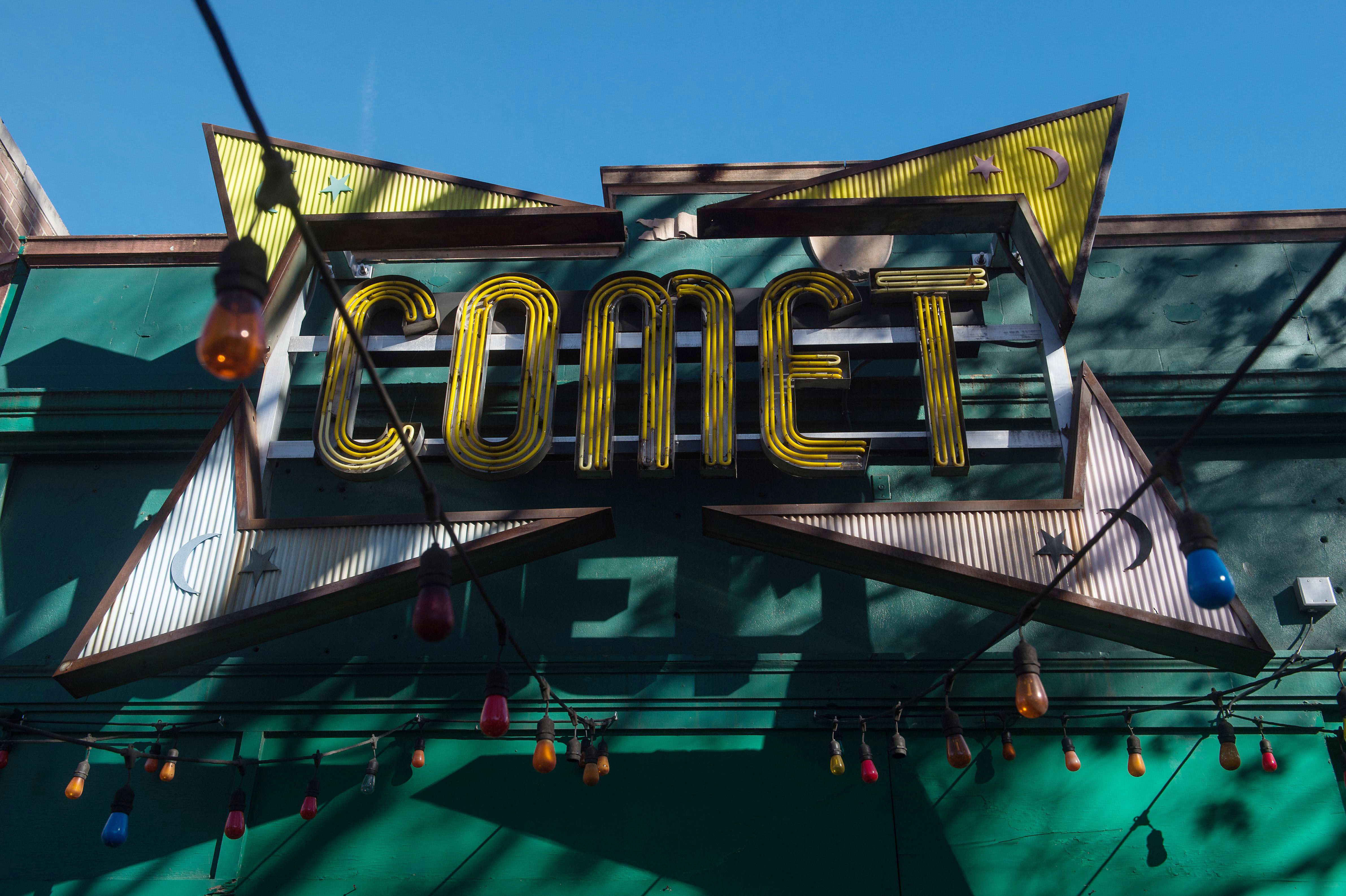 The sign for the Comet Ping Pong restaurant is seen in Washingon, DC, on December 5, 2016. An assault rifle-wielding gunman's appearance at a Washington pizzeria that was falsely reported to house a pedophile ring has elevated worries over the unrelenting rise of fake news and malicious gossip on the internet. No one was injured when 28-year-old Edgar Maddison Welch strode into the Comet Ping Pong restaurant, packed with families on a Sunday afternoon, and fired off a round from his AR-15.