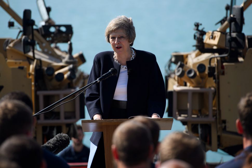 British Prime Minister Theresa May addresses sailors on board HMS Ocean during her trip to attend the Gulf Cooperation Council summit in Bahrain, on December 6, 2016 in Manama, Bahrain.