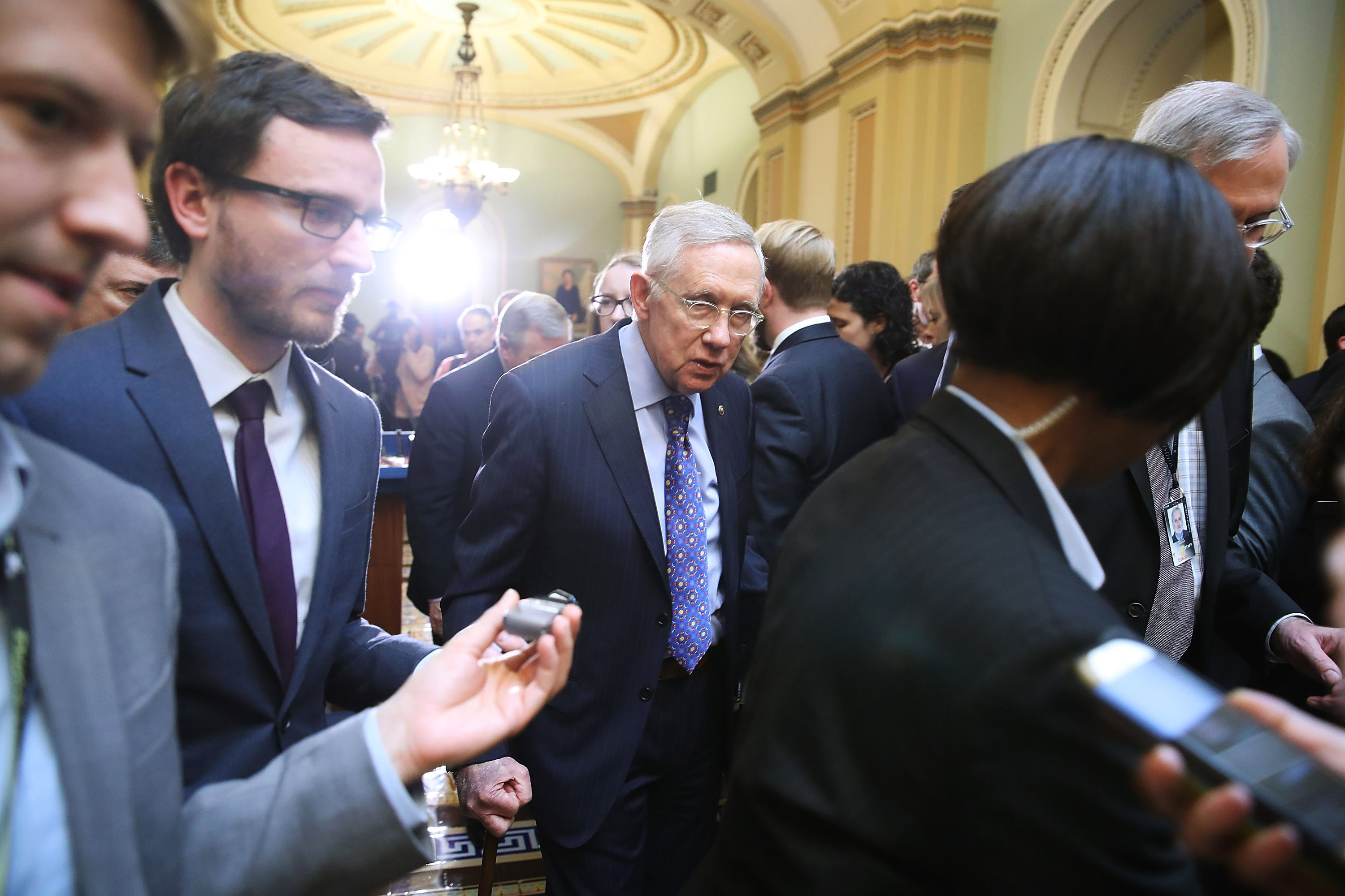 WASHINGTON, DC - DECEMBER 06: Outgoing Senate Minority Leader Harry Reid (D-AZ), (C), walks away after speaking to the media after attending a weekly luncheon with Senate Democrats at the Capitol, December 6, 2016 in Washington, DC. Senate Democrats gathered at the weekly luncheon to discuss their upcoming agenda.