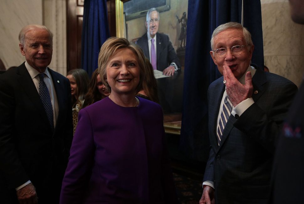 U.S. Senate Minority Leader Sen. Harry Reid , former Secretary of State Hillary Clinton and Vice President Joseph Biden during Reid's leadership portrait unveiling ceremony December 8, 2016 on Capitol Hill in Washington, DC.
