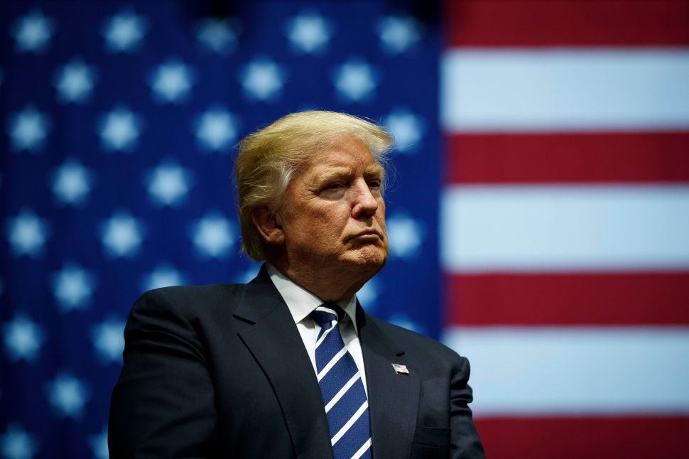 GRAND RAPIDS, MI - DECEMBER 9: President-elect Donald Trump looks on during a rally at the DeltaPlex Arena, December 9, 2016 in Grand Rapids, Michigan. President-elect Donald Trump is continuing his victory tour across the country.