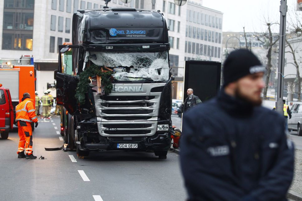BERLIN, GERMANY - DECEMBER 20: Security and rescue workers tend to the area after a lorry truck ploughed through a Christmas market on December 20, 2016 in Berlin, Germany. So far 12 people are confirmed dead and 45 injured. Authorities have confirmed they believe the incident was an attack and have arrested a Pakistani man who they believe was the driver of the truck and who had fled immediately after the attack. Among the dead are a Polish man who was found on the passenger seat of the truck. Police are investigating the possibility that the truck, which belongs to a Polish trucking company, was stolen yesterday morning. 