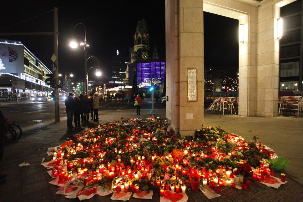 BERLIN, GERMANY - DECEMBER 21: People left flowers and candles to honor the victims of the terrorist attack on a Christmas market.