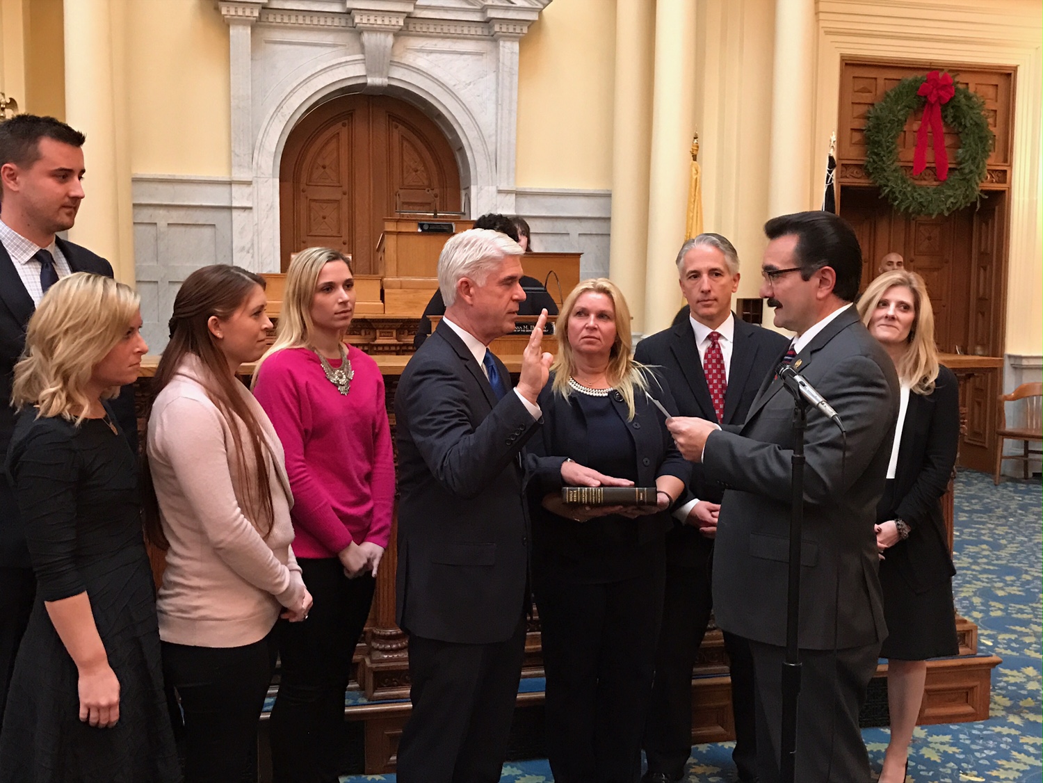 Rooney as he is sworn in by Assembly Speaker Vincent Prieto.